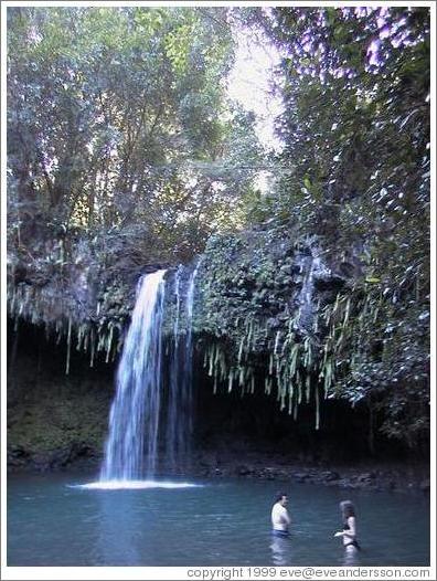 Jin and Beth play in the waterfall. Road to Hana, Maui. 