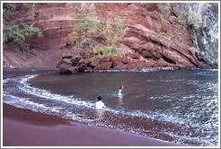 Red sand beach. Jin and Beth in water.  Hana, Maui. 