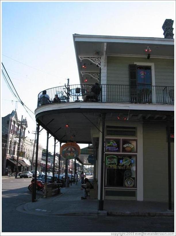 Garden district.  Magazine street.  Bar with balcony.