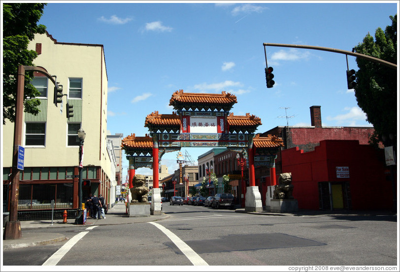 Portland Chinatown gate.  A guy is getting arrested to the left of it.
