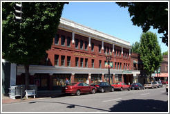 Old brick building labeled "Erickson Saloon 1895." 2nd Ave. and Burnside St., Portland.