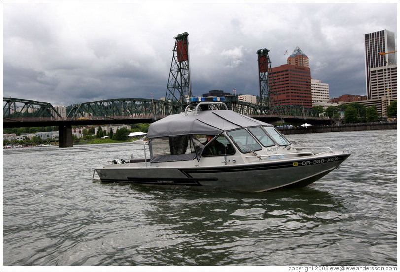 Sheriff boat in front of Hawthorne Bridge, Willamette River.