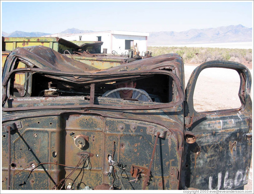 Jesse at helm of old car near Spiral Jetty.