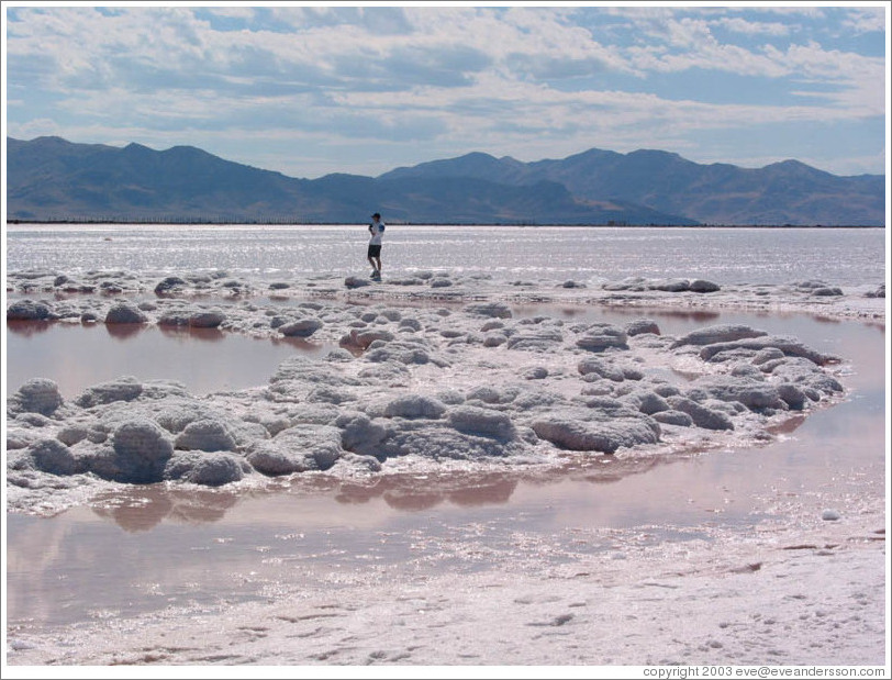 Man walking on Spiral Jetty in the Great Salt Lake.