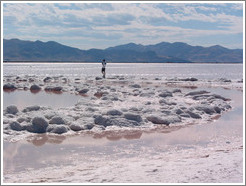 Man walking on Spiral Jetty in the Great Salt Lake.