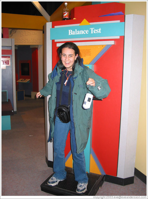 Lissette trying to balance at the Pacific Science Center.