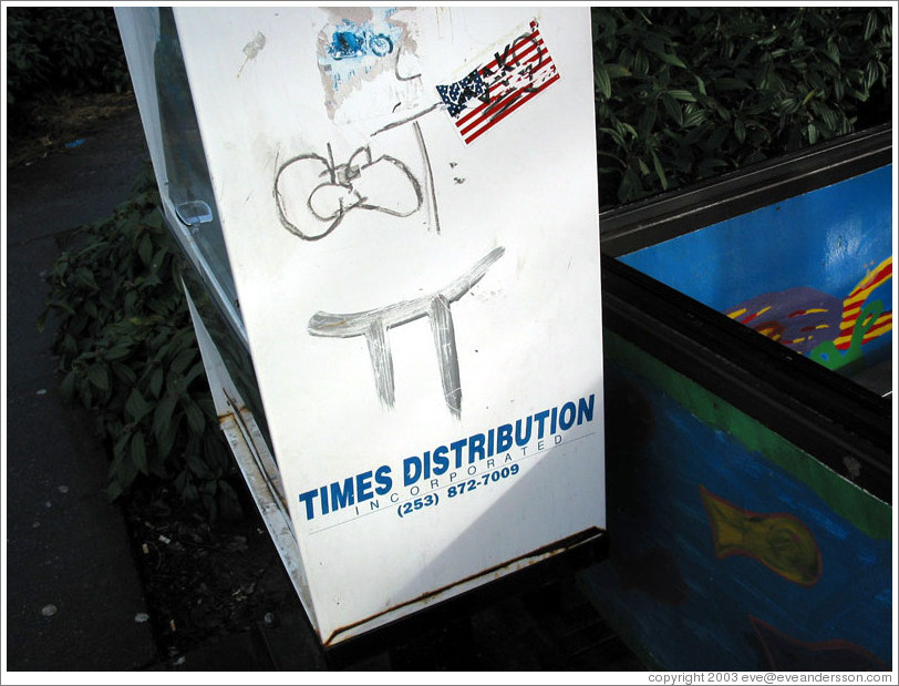 Pi graffiti.  I don't know who created it.  Bus stop.