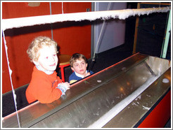 Children creating a huge bubble at the Pacific Science Center.