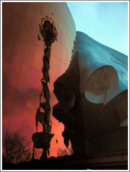 The Space Needle's reflection in the Experience Music Project building.