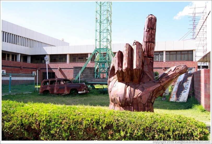 Sculpture depicting a hand pointing upward, the MMD party symbol, outside the Lusaka National Museum.