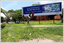 Poles and gloves on the roadside.  May depict the MMD party symbol.